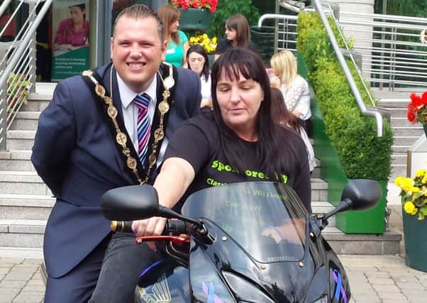 Angela Whitla with Mayor of Lisburn, Councillor Andrew Ewing, at the start of her 800-mile motorcycle challenge.