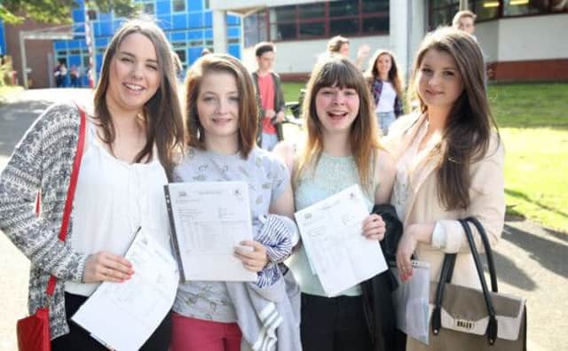 Lynsey Kerr, Amy Clements, Samantha Hill and Naomi Dowling collect their exam results at Fort Hill School. US1433-537cd  Picture: Cliff Donaldson