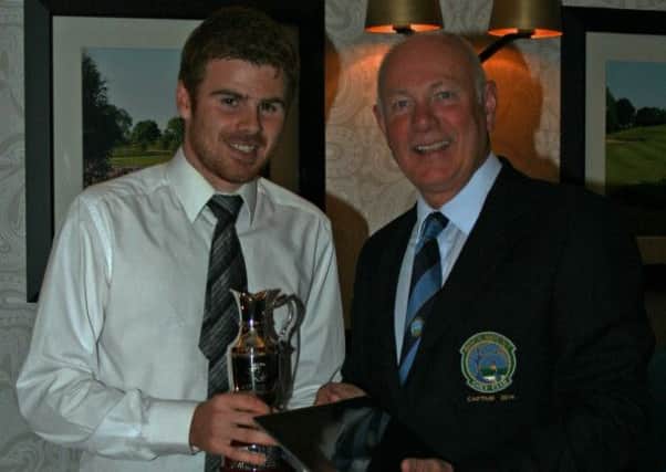 Gents Captain Paul Banford presenting Niall McCabe with the Captains prize.