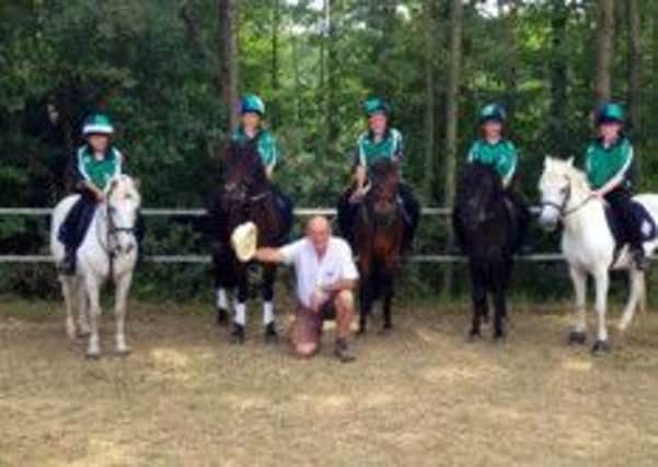 The Northern Ireland Under 12 MGA (Mounted Games Association) team of  L-R, James McNabney, Brigid Delargy, Michael Doherty, Erin Dunseath and William Hamilton who took an impressive  fourth place in the recent European Championships pictured at the event in Belgium, Included is trainer Willie Fearson.
