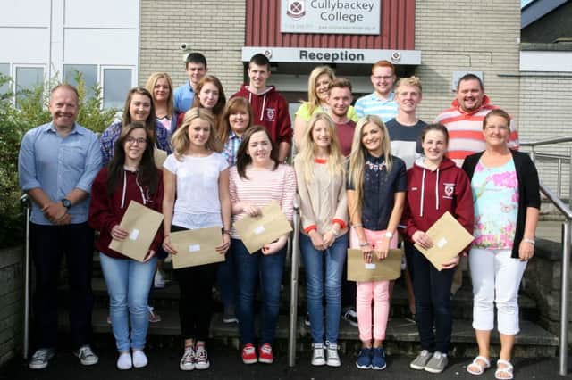 Top A level students from Cullybackey College with Mr. D. Donaldson (Principal), Mr. T. Manson (vice-principal) and Mrs. D. Wilkinson. INBT34-204AC
