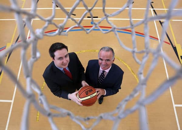 Basketball Direct owner, Niall McDermott with UCI Chief Executive, Harry McDaid.