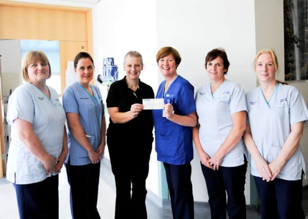 Brave bereaved mother Carol Stewart from Newbuildings, County Londonderry, has donated a substantial £3,000 to Ward 43, the cancer care ward at Altnagelvin Hospital, in memory of her late son who sadly died from cancer earlier this year.
The Newbuildings woman courageously shaved her head to raise money in memory of her son, John Stewart, who had received treatment in Ward 43.
Pictured from left to right at the cheque presentation are: Ward 43 Nurses Lynne Brown, Michelle Downey, Carol Stewart who made the generous donation, and Ward 43 Nurses; Mary McCloskey, Siobhánn Glenn and Debbie Carland.