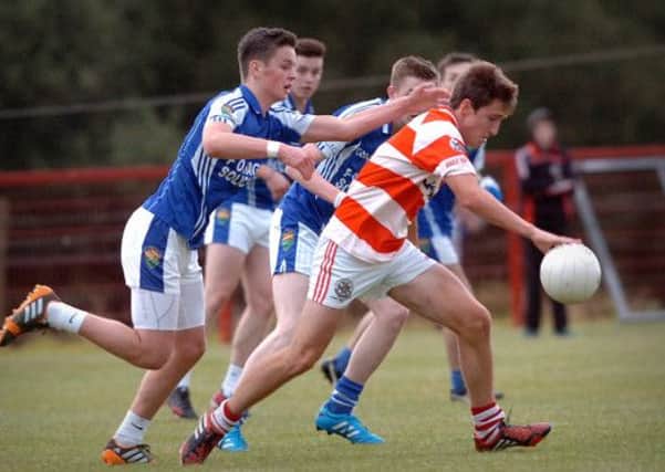 Coalisland's Michael McKernan challenges for the ball during Friday night's minor league final with Moortown played at Stewartstown Harps.INTT3414-383