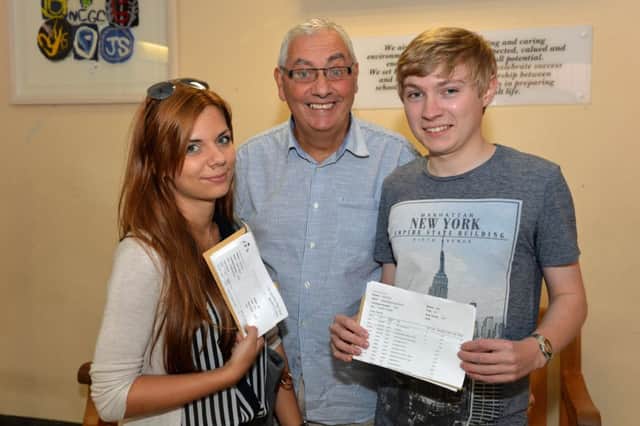 Principal of Glengormley High School, Mr Lex Hayes is pictured with Daria Rybak who attained 2 As, 1 B and 1 C at AS Level and Ethan Hawthorne who got 4 straight As at AS Level. INNT 35-011-PSB