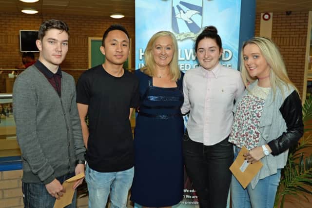 Principal of Hazelwood Integrated College, Kathleen Gormley is pictured with Joe Ainley, John Osano, Tony O`Neill and Kathleen Mulhern on receiving their A Level results. INNT 35-009-PSB
