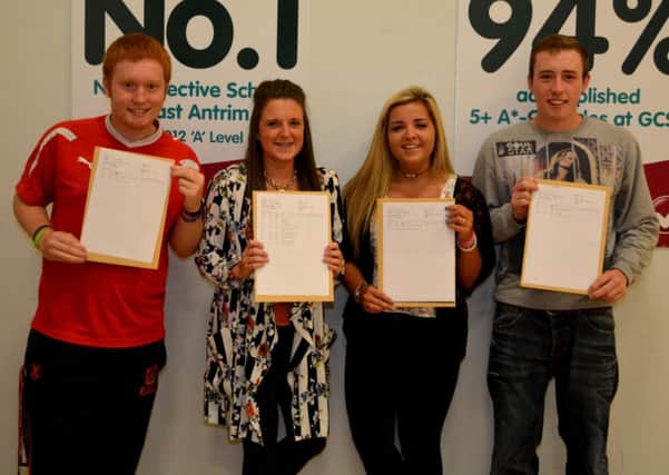 Jason Shepard, Lauren Small, Courtney McWhirter and Matthew Maguire receiving their grades at Ulidia Integrated College. INCT 34-121-GR