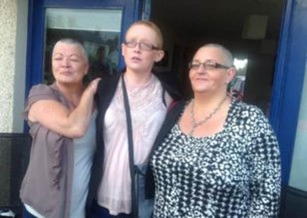 Janine (middle) with her Auntie Sharon Harrison and mum Pauline Hogg before the head shaving party
