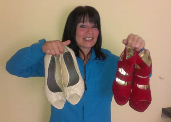 Co-ordinator and Chairperson of PIPS Larne Carlee Letson with some of the size 9 shoes that local men will be wearing at the 'Walk a Mile in my Shoes' event. INLT-34-704-con