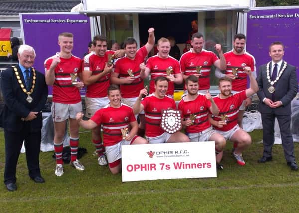 Larne RFC celebrate winning Ophir 7s.  INLT 34-691-CON