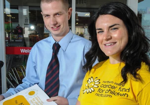 Sorcha Chipperfield from Cancer Fund for Children, receives a cheque for £2,175, from Gary McCullagh from Kellys Eurospar in Moneymore