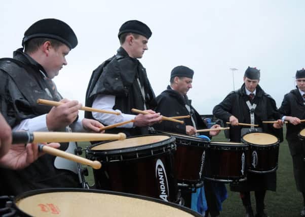Drumming up a treat with Tullylagan Pipe Band at the Mid-Ulster Pipe Band contest.INMM3214-394