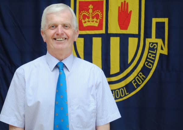 Jordanstown man Johnny Graham OBE is retiring after 13 years as principal of Belfast Model School for Girls.