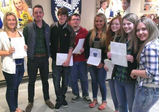 Delighted GCSE students pick up their results at Ballyclare Secondary School. INNT 35-500CON