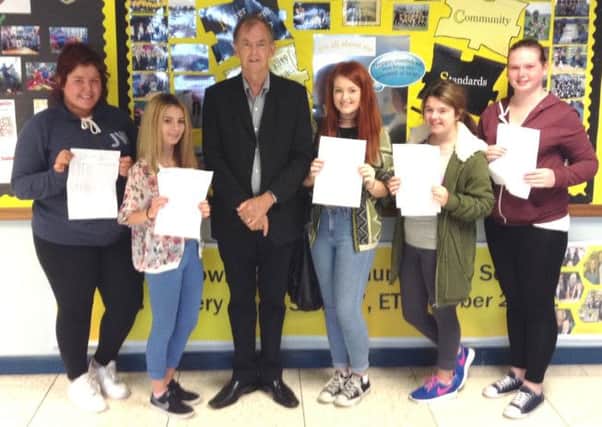 Principal John Lewis with successful GCSE students Rachael Hawthorne, Shannon Mackrell, Emma Pherson, Genna Leigh McNeice and Rebecca Beattie. INNT 35-510CON