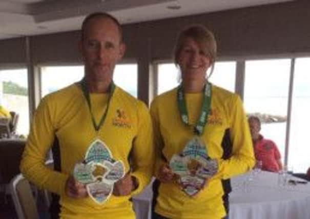Gary Connolly and GIllian Cordner displaying their medals at the Quadrathon event.  INLT 35-676-CON