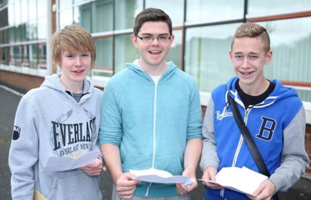 Daniel Johnston, Jack Halley and Matthew Gardiner from Lisnagarvey High collect their GCSE results. US1435-507cd  Picture: Cliff Donaldson
