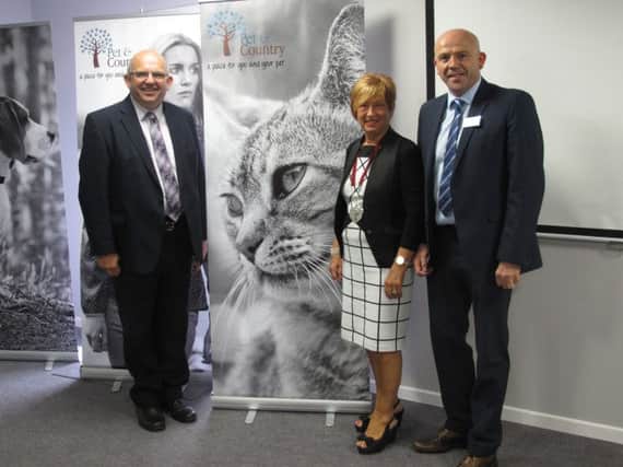 L-R Cllr  John Finlay, Council Development Chair, Winnifred Mellett, President Chamber of Commerce and Colin Christie, in the new Seminar Room at Pet and Country. inbm35-14s