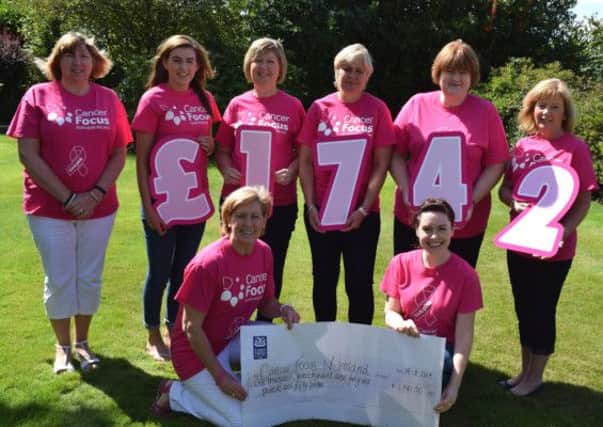 Local ladies who raised £1,742 for Cancer Focus NI. L-R: Carol Cooke, Nicola Wallace, Janice Gibson, Janet McConkey, Janet Wallace, Helen Wallace. Front row: Wendy Wallace and Cancer Focus NI representative Suzi McIlwain. INLT-35-711.con