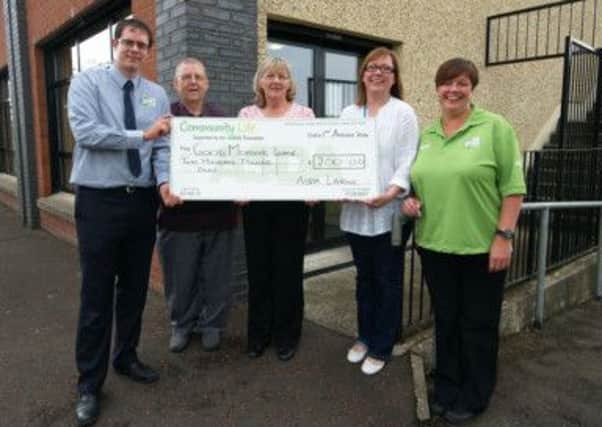 Good Morning Larne Volunteers receive their £200 community champion cheque from ASDA. Pictured L-R are: Gregg Wishart Asda Manager, Matt Ritchie Telephone Volunteer, Rita Hawthorn Telephone Volunteer, Barbara Ann Gilchrist Good Morning Larne Co -Ordinator and Catherine McCallion Asda Community Champion. INLT-35-712-con