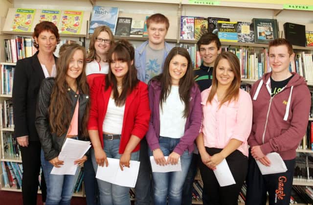 THEY ARE JUST GR'EIGHT'. Acting Principal at Our Lady or Lourdes, Elish Gillan, pictured along with the school's top GCSE achievers. They are, Laura Kelly, Catriona Dunlop, Shamilla Dillon, Matthew Armstrong, Katie Kelly, Alexander Dowrzycz, Ryan Elliott and Ciaran Elliott.INBM35-14 005SC.