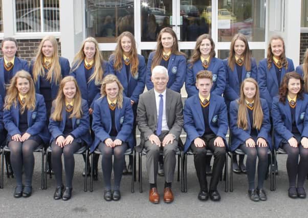St. Michael's principal Mr Gerard Adams with the top students at the school in GCSE results include Rebekah Clenaghan; Sarah Doherty; Lucy Doyle; Orlagh Dummigan; Sinead Flannagan; Ciara Fox; Caroline Gallery; Aisling Lavery; Orla Magennis; Orlagh McConville; Amyrose McInerney; Sophie McManus; James McMorrow; Caitlin McQuade; Katie Moore; Sarah O'Hagan; Aisling O'Neill; Maria Quinn and Orla Ward. INLM35-504G