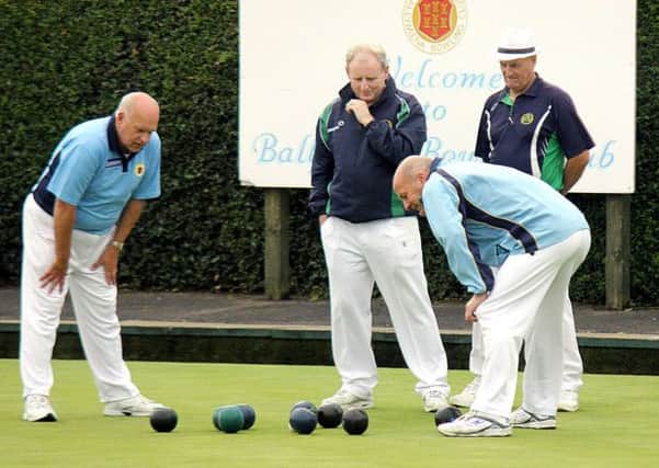 Closer inspection on the lay of the bowls round the jack was needed during this end in Ballymena Seniors' match against Falls. INBT 35-927H
