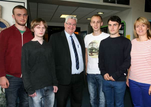Paul Davidson, Lee Mason, Josh Hunter and Conor Crilly, from Slemish College, who received excellent A Level results, are pictured with Dr. Paul McHugh (principal) and Mrs. Donna Mitchell (head of sixth form). INBT35-212AC