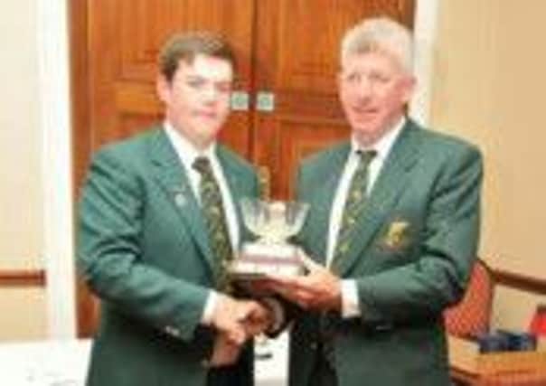 Irish team Manager Frank Dempsey presenting Andrew with Lough Owel trophy.