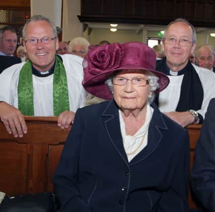 SPECIAL SERVICE. Mrs Molly Holmes, who celebrated her 100th Birthday on Sunday, pictured at a special service held in St Patrick's Church of Ireland along with Minister Rev Andrew Sweeney and Curate Brian Howe.INBM35-14 061SC.