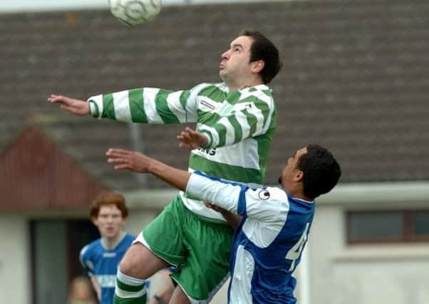 Cookstown Celtic's Gary Maguire wins a header