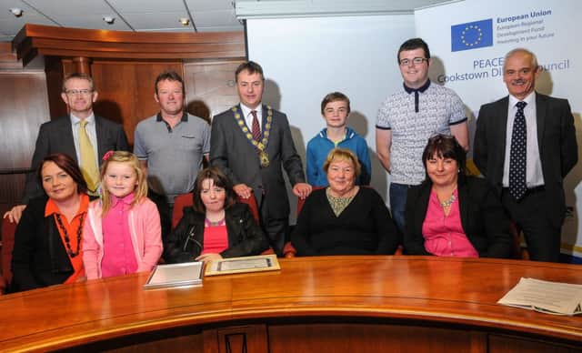 Cookstown District Council Chairman Councillor Wilbert Buchanan, Adrian McCreesh (Chief Executive) and Dominic McCanny pictured with Aine and her friends and family at the special reception.