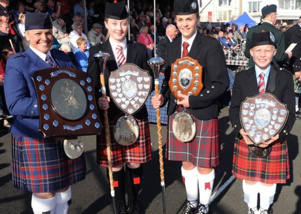 The 2014 drum major Champion of Champions and winners on the day at the North West Pipe Band & Drum Major Championships at Ramore Head, Portrush on Saturday, August 23, were  from left: Adult Grade - Paula Braiden (Cullybackey); Juvenie Grade, Lauren Abraham (Raffrey); Junior Grade, Zoe McDowell (Aughintober) and Novice Grade, Jamie Cupples (Killeen).