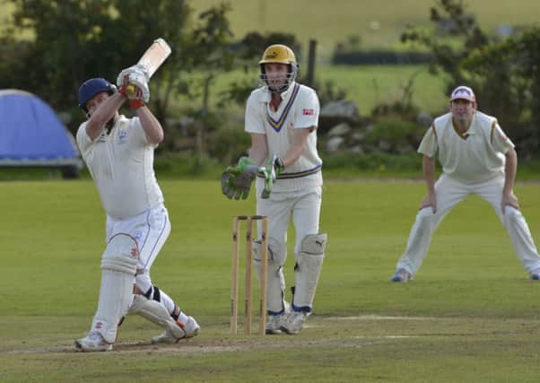 Sion Mills batsman Simon Galloway smashes this ball towards the boundary during Saturday's match against Bonds Glen. INLS3414-141KM