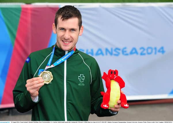 Michael McKillop with his gold medal on Saturday.  INLT 35-685-CON