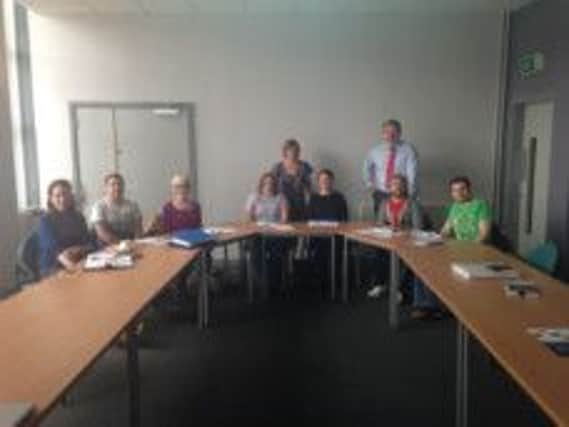 Kelli Bagchus, manager of Carrickfergus Enterprise and Donal Leahy, Enterprise Northern Ireland with business 'bootcamp' participants. INCT 36-706-CON