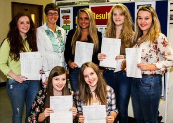 Principal Mrs Kathryn Bell with successful GCSE students Chloe Hamilton, Megan McNeilly, Laura Beattie, Danika McCabe, Adrianna Coulter and Aimee Laird. INNT 34-507-SO