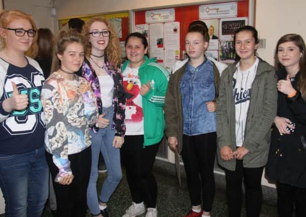 Caitlyn McCrea, Keeley McKee, Anna Campbell, Hannah Spencer, Jodie-Lee McDonald, Chloe Spencer and Sophie Kidd collect their GCSE results at Glengormley High School. INNT 35-501CON