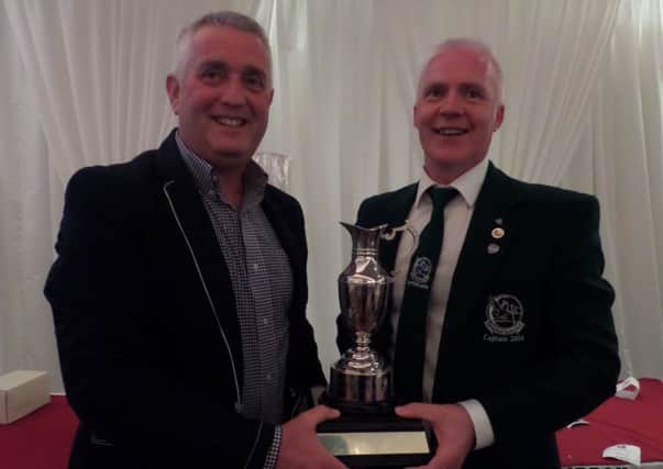 Faughan Valley Captain Robert Curry (right) presents his Captain's Day prize to winner and vice-captain Frank McClintock.
