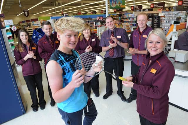 Lisburn lad Matthew Lightbody, (15), who is the Irish No 1 Badminton champ, gives a few tips to Clare Clarke in Sainsburys Sprucefield store.  Also included are, (from left), Abby Corrigan, Terence Cullen, Joanne McCormick, Dwan Toland and Scott Dando.