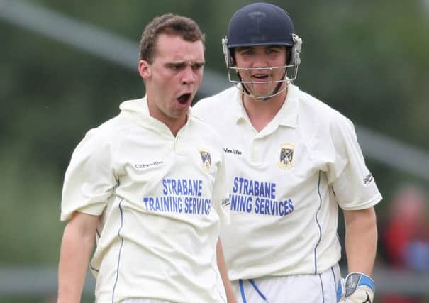 North West Warriors' Andrew McBrine celebrates a wicket with Ricky Lee Dougherty. Picture by Lorcan Doherty/Presseye.com