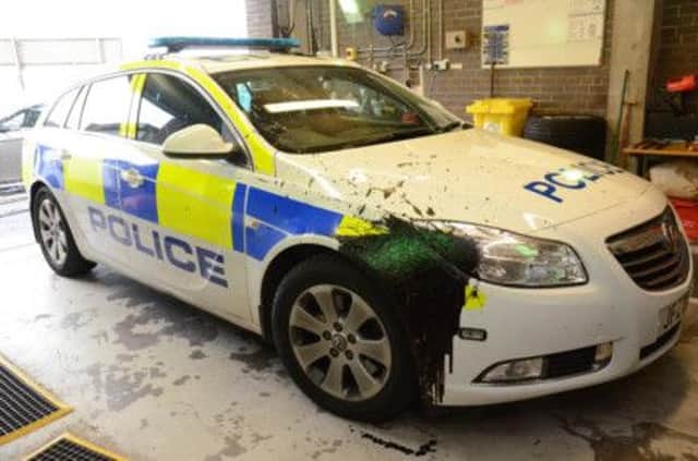 The police car which was attacked by up to ten masked men as officers attended a hoax call in Moygashel.