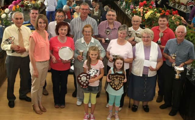 BLOOMING GREAT. Pictured are prizewinners from the North Antrim Horticultural Association's annual Show on Saturday at the Parish Centre. Included (3rd left) is Guest, BBC News Presenter Kerry Thompson.INBM36-14 034SC.