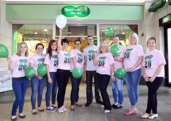 Staff from Specsavers celebrate their 20th anniversary of the store in Ballymena. INBT36-219AC