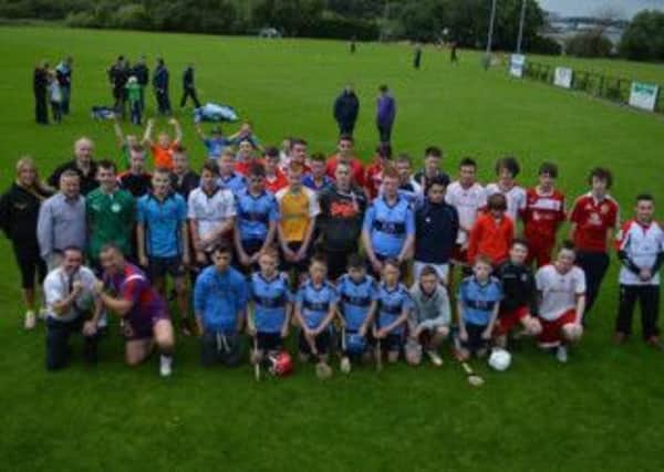 Some of the eager participants, coaches and local sporting celebrities at the Game of Three Halves event. INLT 36-910-CON
