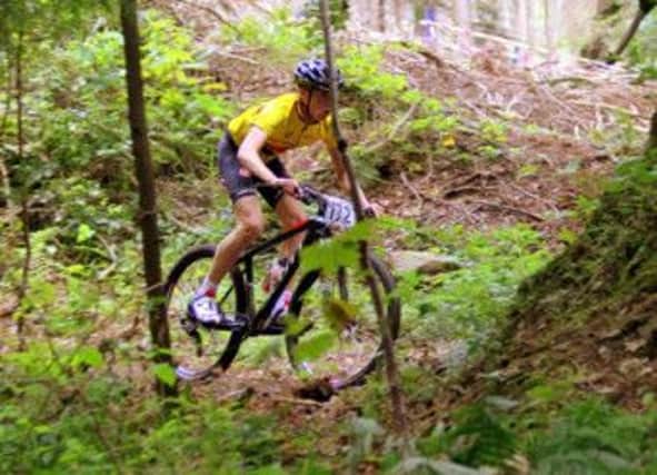 U16 winner Cameron McIntyre in the forest.