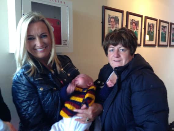 Jo-Anne Dobson with Banbridge Rugby Clubs youngest member, 1 month old Thoe Allen proudly displaying the club colours with his Gran Sharon Allen.