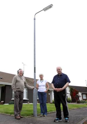 Meadowvale Park residents Lawrence Smyth, Isobel Doyle and Andy Ferris who are unable to get the street light fixed outside their Limavady homes due to cut backs in the budget for roads maintenance. INLV3514-661KDR