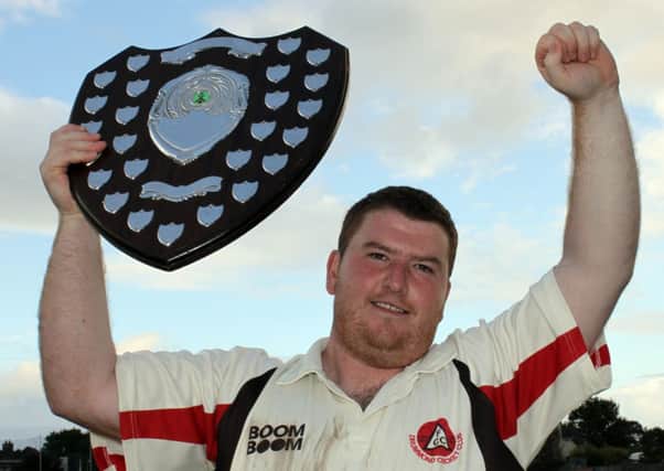 Victorious Drummond captain Stevie Moore holds aloft the Sammy Jeffrey Shield, after their win over St Johnston.