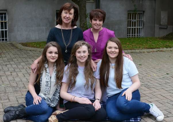 Lurgan girls, students from Sruth na Gaeilge, the Irish Medium stream in St. Catherines College, Armagh, feature amongst the Top Achievers at GCSE. l/r: Aoife Curran (3A*/6A/1B/1C), Eva Mallon (4A*/3A/3B) and Niamh Haughian (3A*/8A/1B). The girls are pictured here with Principal Deirdre McDonald (back left) and Caitríona de Bléine (Co-ordinator, Sruth na Gaeilge).